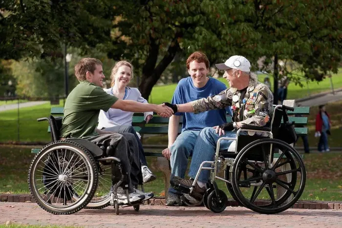 Framed Print : Veterans joining friends and shaking hands in the park
