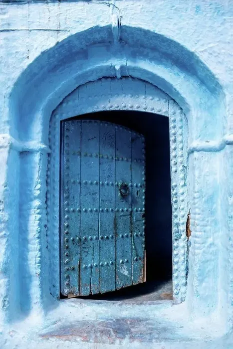 Framed Print : Vibrant blue colored wooden door in downtown Chefchaouen, Morocco Framed Print : Vibrant blue colored wooden door in downtown Chefchaouen, Morocco