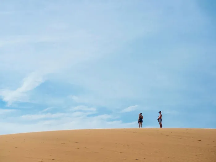Framed Print : Vietnam, Mui Ne. People on sand dune. (MR) Framed Print : Vietnam, Mui Ne. People on sand dune. (MR)
