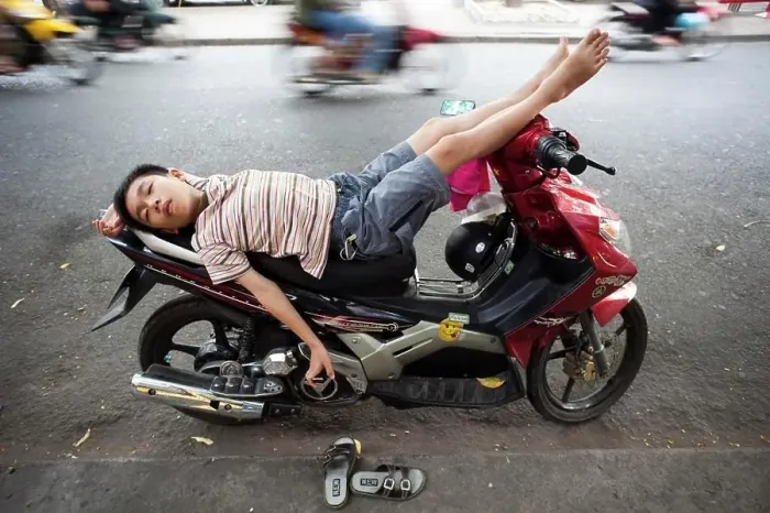 Framed Print : Vietnam, Vietnam, Ho Chi Minh City, Boy Sleeping on Motorbike Framed Print : Vietnam, Vietnam, Ho Chi Minh City, Boy Sleeping on Motorbike