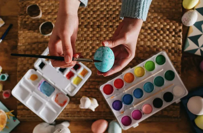 Framed Print : From above top view of cropped unrecognizable person in sweater covering fresh chicken eggs with blue paint while Framed Print : From above top view of cropped unrecognizable person in sweater covering fresh chicken eggs with blue paint while