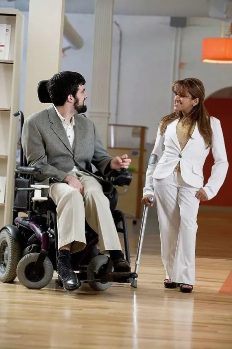 Framed Print : View of a man with Cerebral Palsy and woman conversing Framed Print : View of a man with Cerebral Palsy and woman conversing