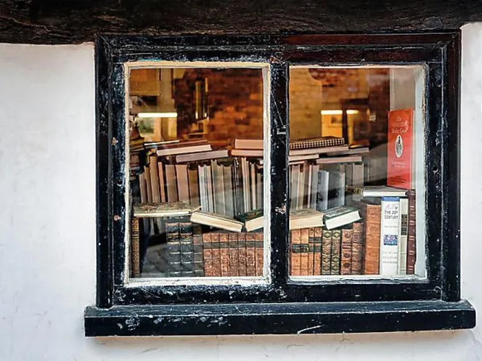 Framed Print : View through an old window on stacks of books, antiquarian bookshop, Lincoln, Lincolnshire, England, Great Britain Framed Print : View through an old window on stacks of books, antiquarian bookshop, Lincoln, Lincolnshire, England, Great Britain