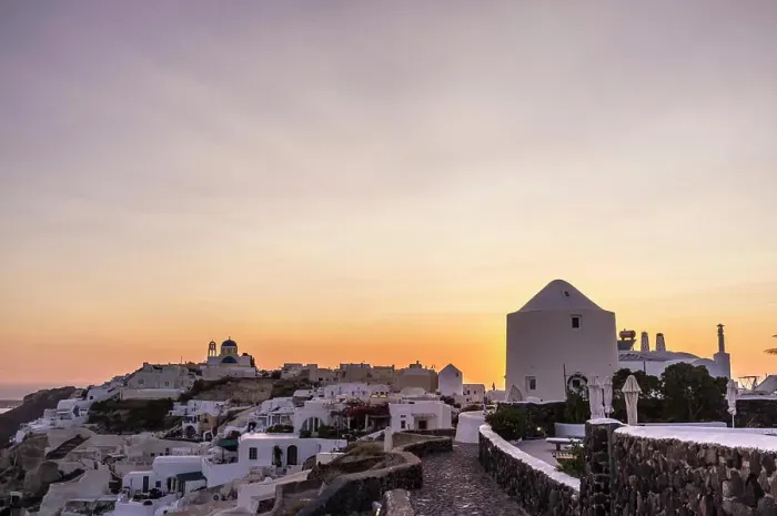 Framed Print : View of town at sunset, Oia, Santorini, Greece