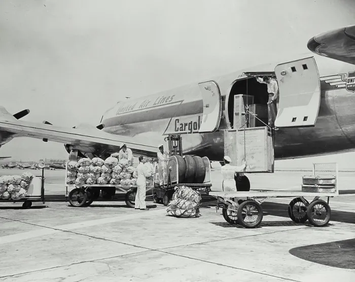 Framed Print : Vintage photograph. Four engined United Air Line Cargoliner 230 exterior view showing loading of cargo on tarmac Framed Print : Vintage photograph. Four engined United Air Line Cargoliner 230 exterior view showing loading of cargo on tarmac