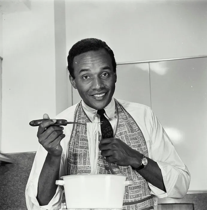 Framed Print : Vintage Photograph. African American man in apron making dinner