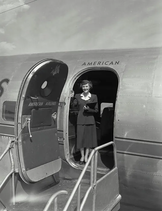 Framed Print : Vintage photograph. American airlines stewardess standing in plane doorway Framed Print : Vintage photograph. American airlines stewardess standing in plane doorway