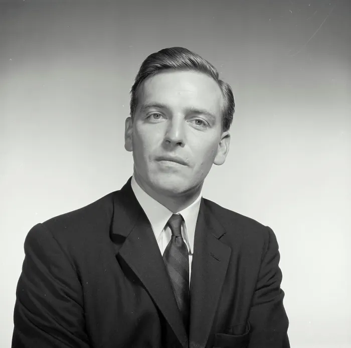 Framed Print : Vintage Photograph. With a blank stare a man sits for a studio portrait Framed Print : Vintage Photograph. With a blank stare a man sits for a studio portrait