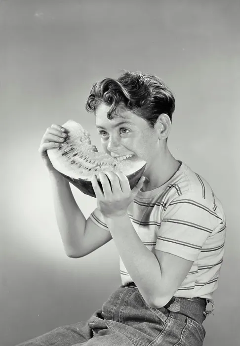 Framed Print : Vintage photograph. Boy smiling eating watermelon Framed Print : Vintage photograph. Boy smiling eating watermelon