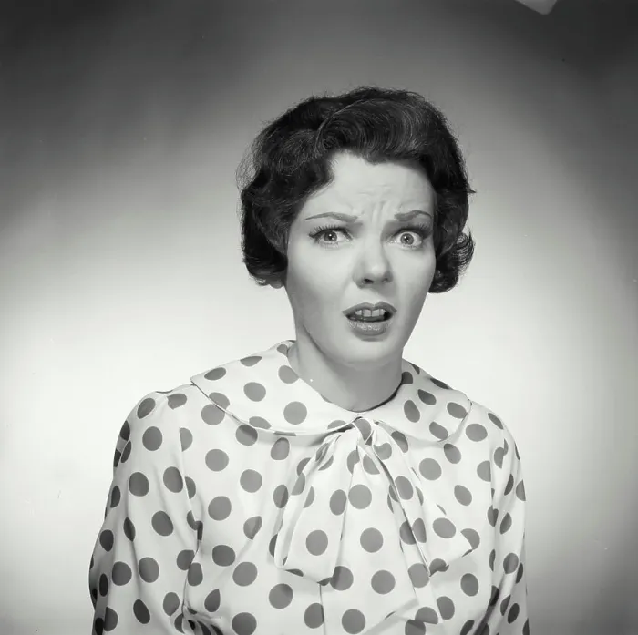 Framed Print : Vintage Photograph. Brunette woman wearing polka dot blouse looking at camera with shocked expression Framed Print : Vintage Photograph. Brunette woman wearing polka dot blouse looking at camera with shocked expression