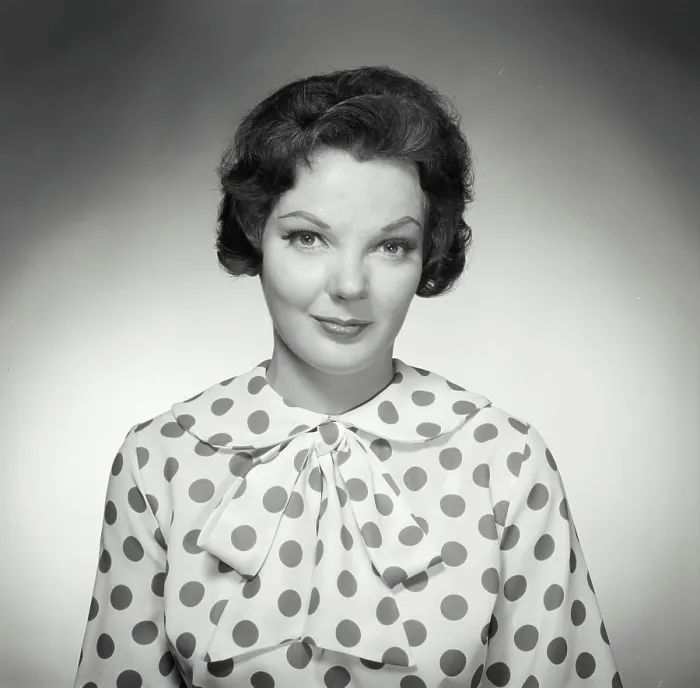 Framed Print : Vintage Photograph. Brunette woman wearing polka dot blouse looking at camera with warm expression Framed Print : Vintage Photograph. Brunette woman wearing polka dot blouse looking at camera with warm expression