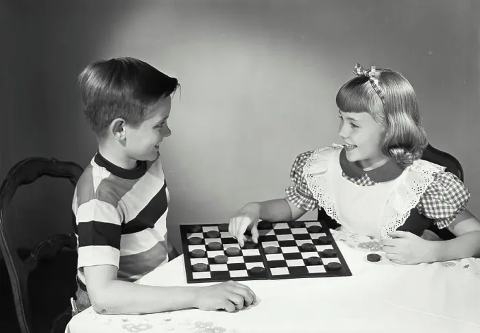 Framed Print : Vintage photograph. Children at table playing checkers Framed Print : Vintage photograph. Children at table playing checkers