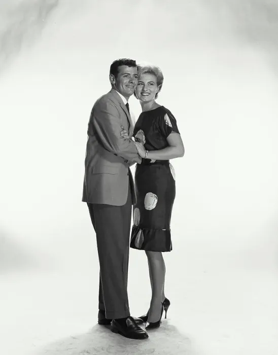 Framed Print : Vintage Photograph. A couple holding each other smiling looking to the left of frame Framed Print : Vintage Photograph. A couple holding each other smiling looking to the left of frame