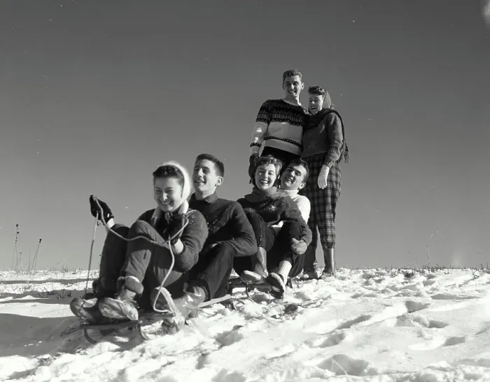 Framed Print : Vintage Photograph. Two couples sledding down snow covered hill as another watches at top Framed Print : Vintage Photograph. Two couples sledding down snow covered hill as another watches at top