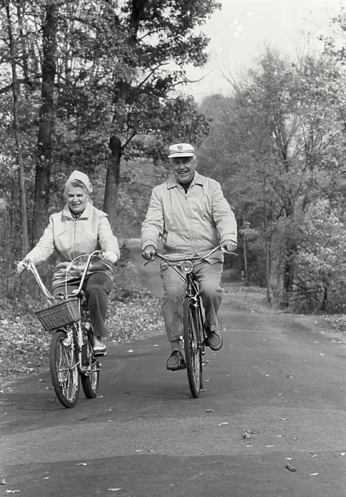 Framed Print : Vintage Photograph. Elderly couple riding bicycles down autumn road Framed Print : Vintage Photograph. Elderly couple riding bicycles down autumn road