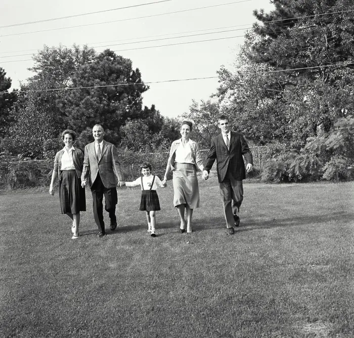 Framed Print : Vintage Photograph. Family walking together in backyard Framed Print : Vintage Photograph. Family walking together in backyard