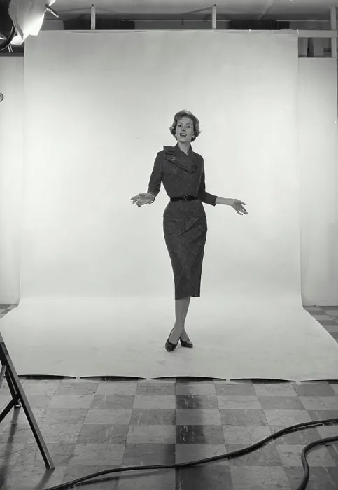 Framed Print : Vintage Photograph. Full length view of Businesswoman on white studio background, holding hands out to side, Frame 1
