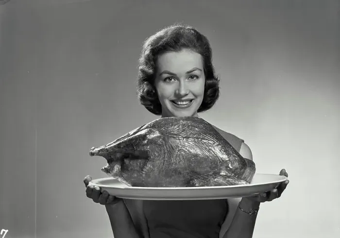 Framed Print : Vintage Photograph. Lucy Cort. Model Released. Portrait of woman in sleeveless blouse holding turkey Framed Print : Vintage Photograph. Lucy Cort. Model Released. Portrait of woman in sleeveless blouse holding turkey