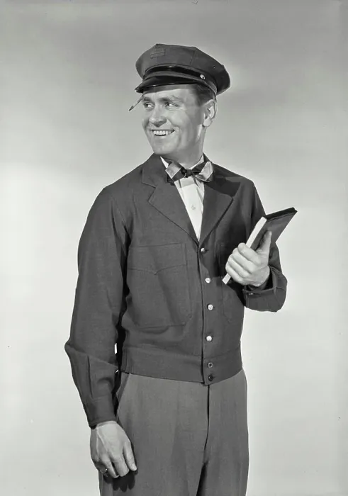 Framed Print : Vintage Photograph. Mailman in uniform with pencil stuck in hat brim holding up notepad smiling Framed Print : Vintage Photograph. Mailman in uniform with pencil stuck in hat brim holding up notepad smiling