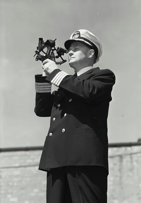 Framed Print : Vintage Photograph. Man in captains uniform standing and looking through sailor protractor off into the distance Framed Print : Vintage Photograph. Man in captains uniform standing and looking through sailor protractor off into the distance