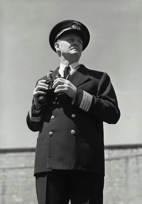 Framed Print : Vintage Photograph. Man in captains uniform standing with set of binoculars Framed Print : Vintage Photograph. Man in captains uniform standing with set of binoculars