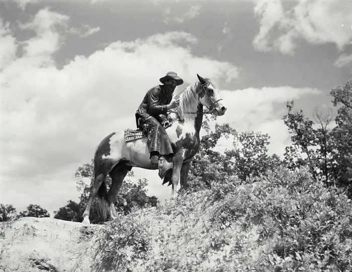 Framed Print : Vintage Photograph. Man in chaps and bandana riding on horses back. Frame 2 Framed Print : Vintage Photograph. Man in chaps and bandana riding on horses back. Frame 2