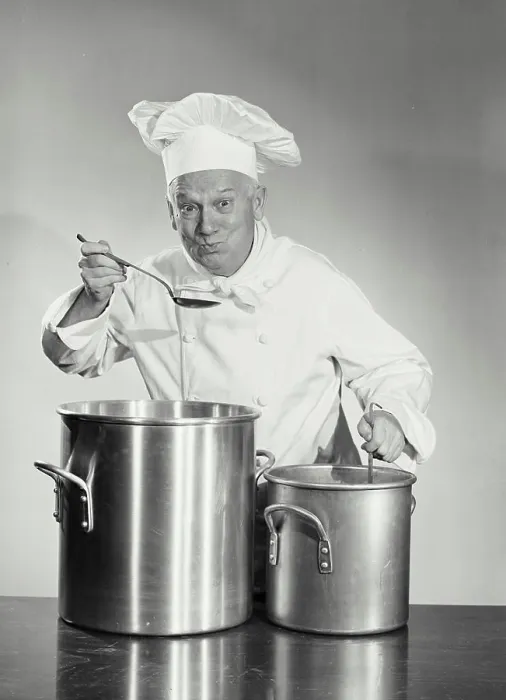 Framed Print : Vintage photograph. man in chef uniform cooking in pot Framed Print : Vintage photograph. man in chef uniform cooking in pot