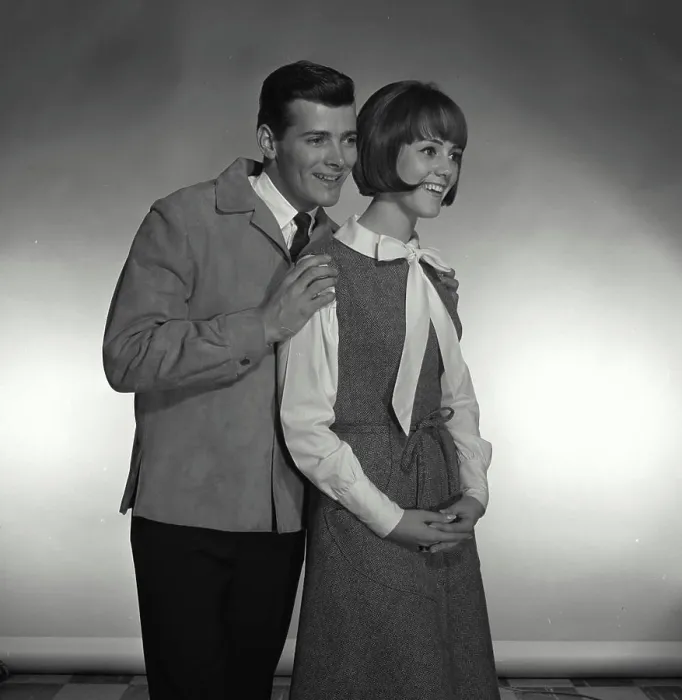 Framed Print : Vintage Photograph. A man hugging woman on the shoulders while they both look to the right of frame