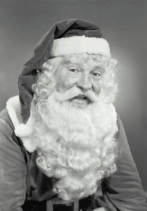 Framed Print : Vintage photograph. Man in Santa Claus costume smiling