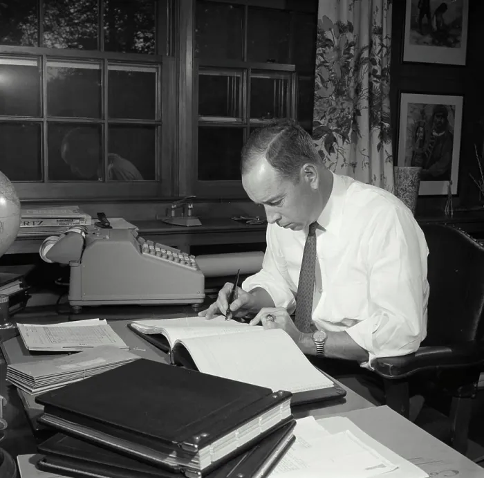 Framed Print : Vintage Photograph. Man seen Checking notes