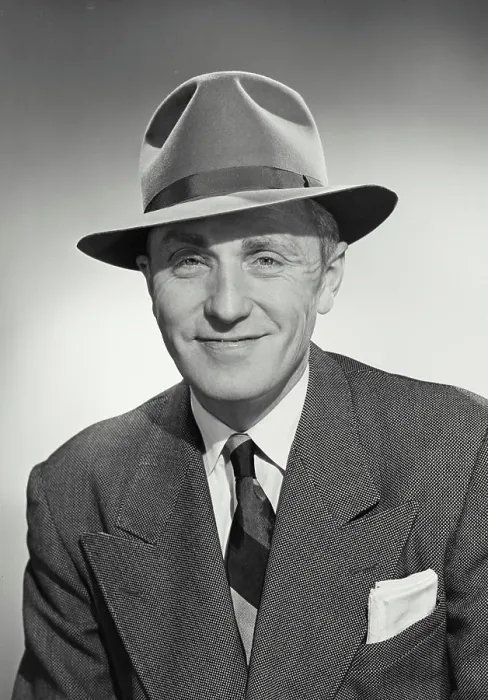 Framed Print : Vintage photograph. Man in suit and tie wearing hat and smiling at camera Framed Print : Vintage photograph. Man in suit and tie wearing hat and smiling at camera
