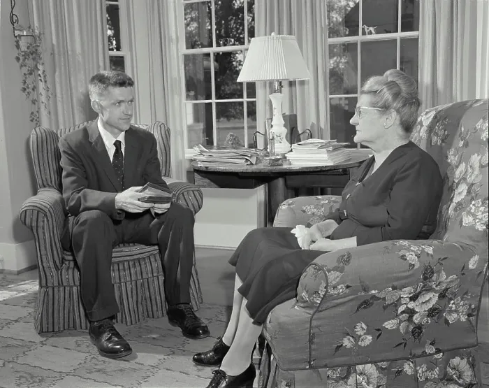 Framed Print : Vintage Photograph. Minister talking to woman in her home. Frame 1 Framed Print : Vintage Photograph. Minister talking to woman in her home. Frame 1