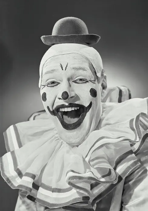 Framed Print : Vintage photograph. Portrait of clown wearing silly hat and smiling Framed Print : Vintage photograph. Portrait of clown wearing silly hat and smiling