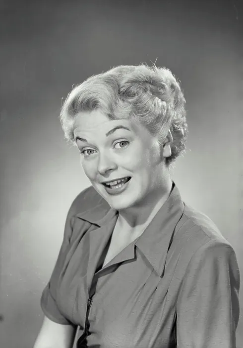 Framed Print : Vintage photograph. Portrait of woman in collared blouse smiling at camera