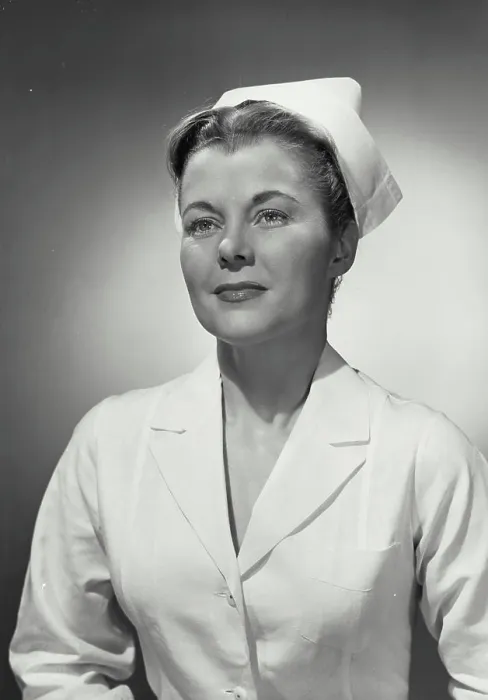 Framed Print : Vintage photograph. Portrait of woman in nurse uniform looking off camera Framed Print : Vintage photograph. Portrait of woman in nurse uniform looking off camera