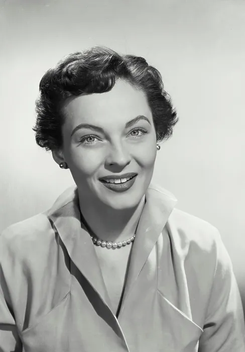 Framed Print : Vintage photograph. Portrait of Woman with short hair smiling at camera