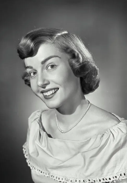 Framed Print : Vintage photograph. Portrait of woman smiling with head tilted