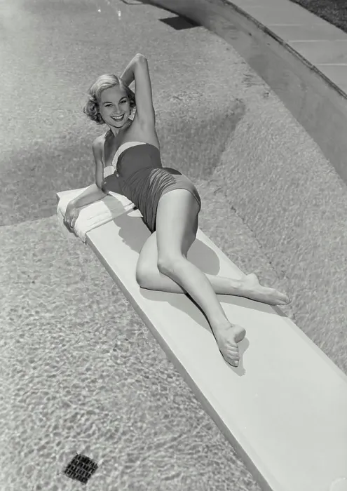 Framed Print : Vintage Photograph. Smiling blonde woman wearing bathing suit lying on diving board over swimming pool, Frame 1 Framed Print : Vintage Photograph. Smiling blonde woman wearing bathing suit lying on diving board over swimming pool, Frame 1