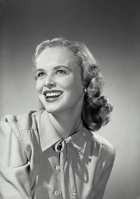 Framed Print : Vintage Photograph. Smiling blonde woman wearing button up blouse with knot tied on collar Framed Print : Vintage Photograph. Smiling blonde woman wearing button up blouse with knot tied on collar