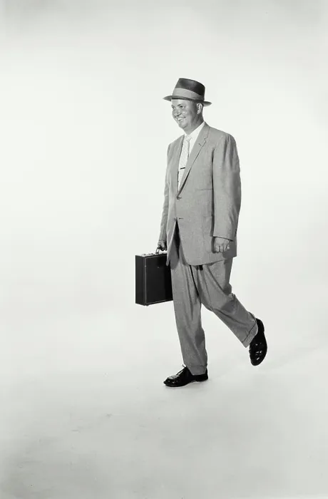 Framed Print : Vintage Photograph. A studio shot of a man wearing a suit and holding a briefcase walking across frame. Frame 2 Framed Print : Vintage Photograph. A studio shot of a man wearing a suit and holding a briefcase walking across frame. Frame 2