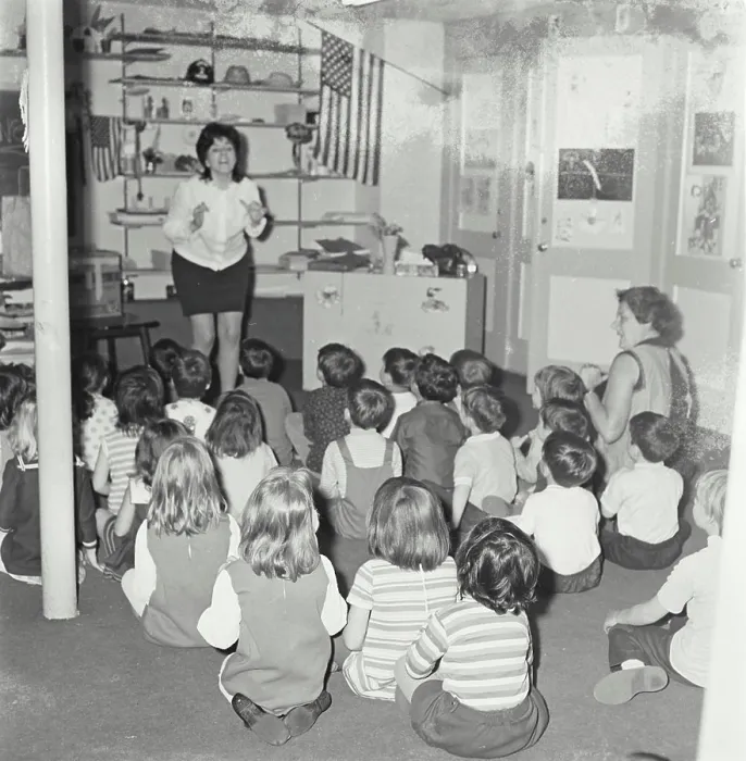Framed Print : Vintage Photograph. A teacher singing in a small elementary school class