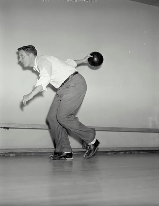 Framed Print : Vintage photograph. Side view of man throwing bowling ball down lane Framed Print : Vintage photograph. Side view of man throwing bowling ball down lane