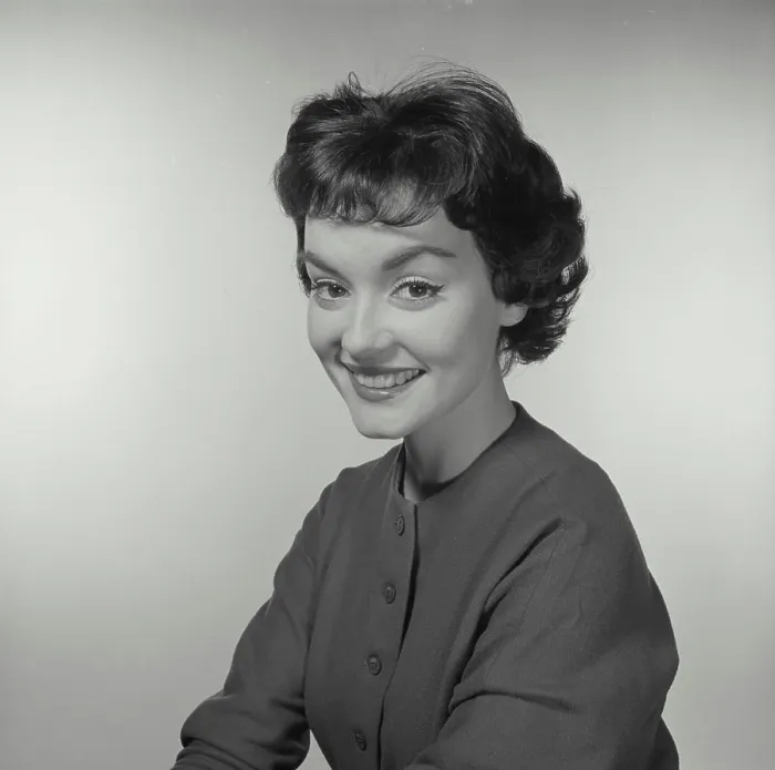 Framed Print : Vintage Photograph. Woman looks to the left while she smiles at the camera Framed Print : Vintage Photograph. Woman looks to the left while she smiles at the camera