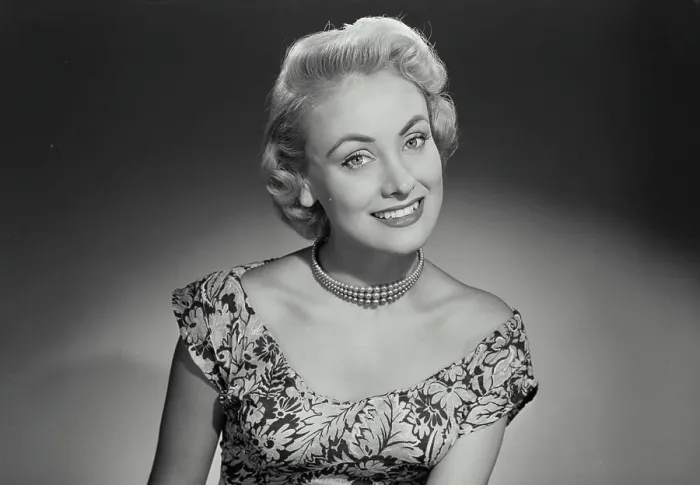 Framed Print : Vintage Photograph. Woman in lowcut dress smiling at camera