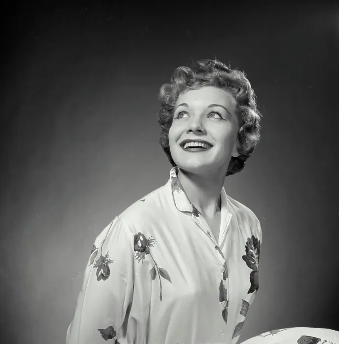 Framed Print : Vintage Photograph. Woman poses for studio portrait she looks to the top left of frame and smiles big Framed Print : Vintage Photograph. Woman poses for studio portrait she looks to the top left of frame and smiles big