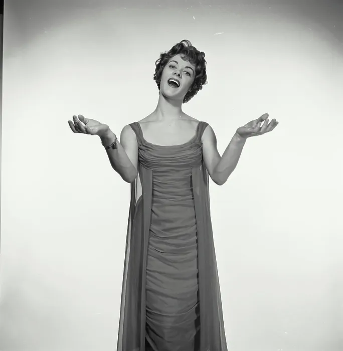 Framed Print : Vintage Photograph. Woman in studio portrait sings while she has her hands with palms up to her sides Framed Print : Vintage Photograph. Woman in studio portrait sings while she has her hands with palms up to her sides