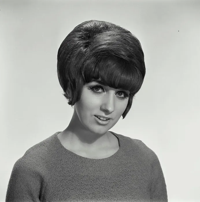 Framed Print : Vintage Photograph. Woman in sweater on blank background looking at camera Framed Print : Vintage Photograph. Woman in sweater on blank background looking at camera