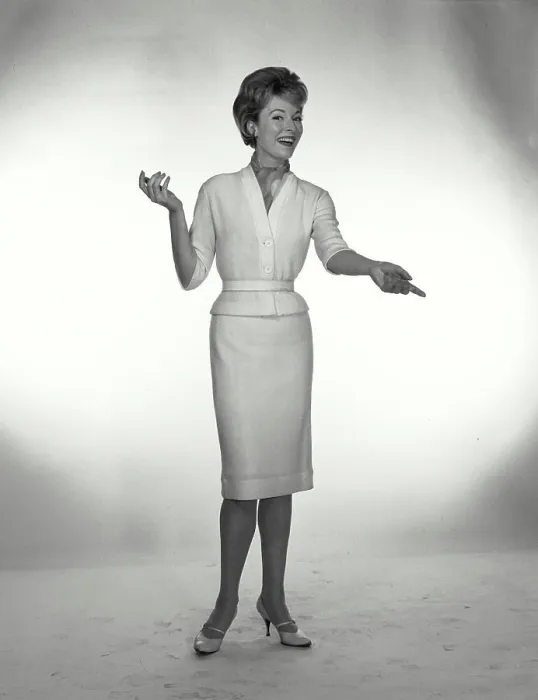 Framed Print : Vintage Photograph. A woman wearing a neckerchief tucked into a sweater, gesturing off camera Framed Print : Vintage Photograph. A woman wearing a neckerchief tucked into a sweater, gesturing off camera