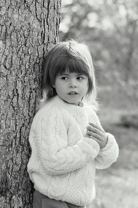 Framed Print : Vintage Photograph. A young girl leaning against a tree Framed Print : Vintage Photograph. A young girl leaning against a tree