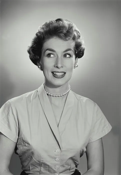 Framed Print : Vintage Photograph. Young woman cringes while she looks to the left of frame Framed Print : Vintage Photograph. Young woman cringes while she looks to the left of frame